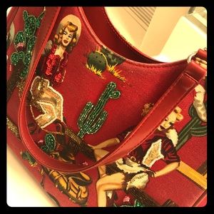 Vintage purse with sexy cowgirls